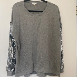 Charming Charlie’s long sleeve top with sequin arms.